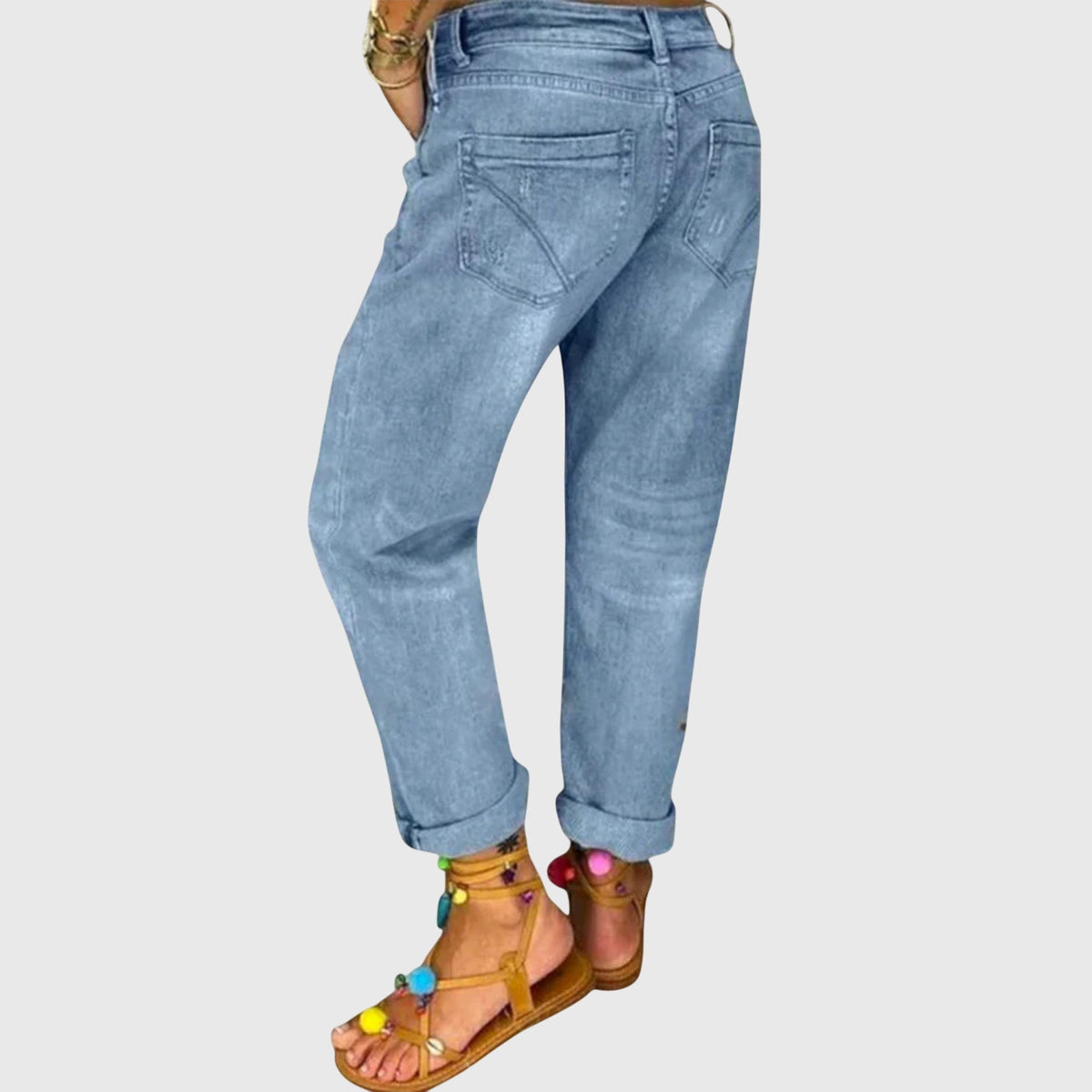 Rear view of the Zara relaxed straight jeans, highlighting the back pockets and overall silhouette on a model walking outdoors.