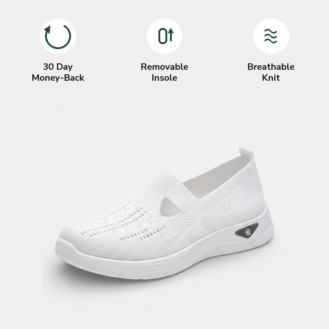 Bottom view of a beige Margot comfort slip-on sneaker, showing the sole's tread pattern for grip.
