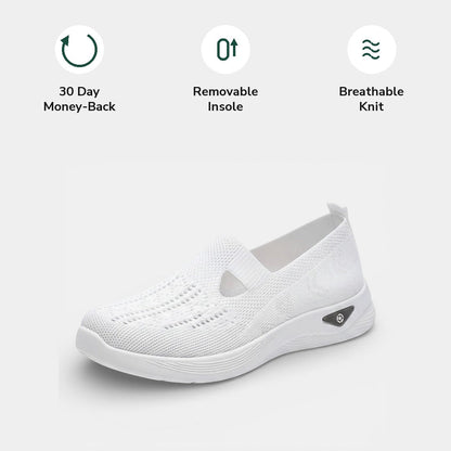 Bottom view of a beige Margot comfort slip-on sneaker, showing the sole's tread pattern for grip.