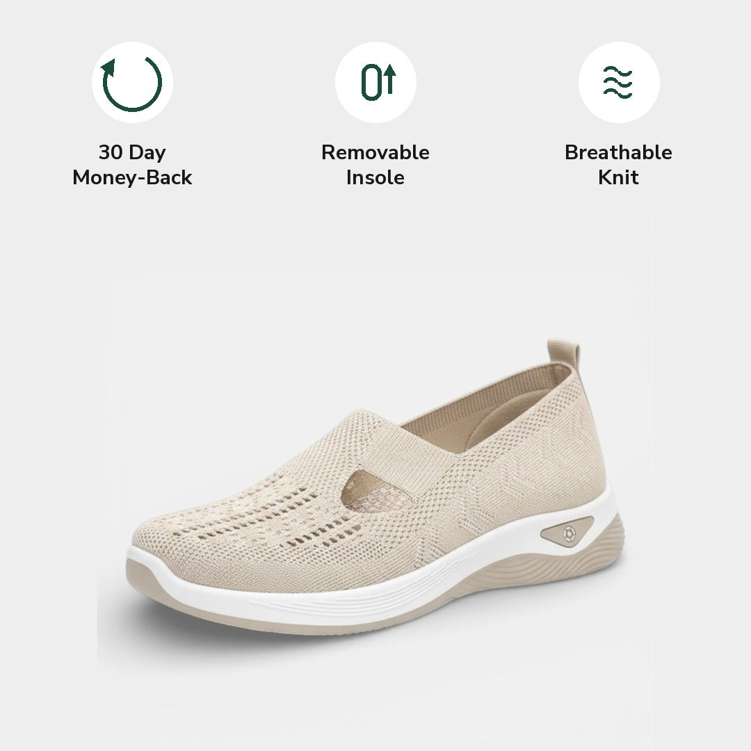 A foot resting comfortably inside a Margot sneaker, indicating the spaciousness and support provided.
