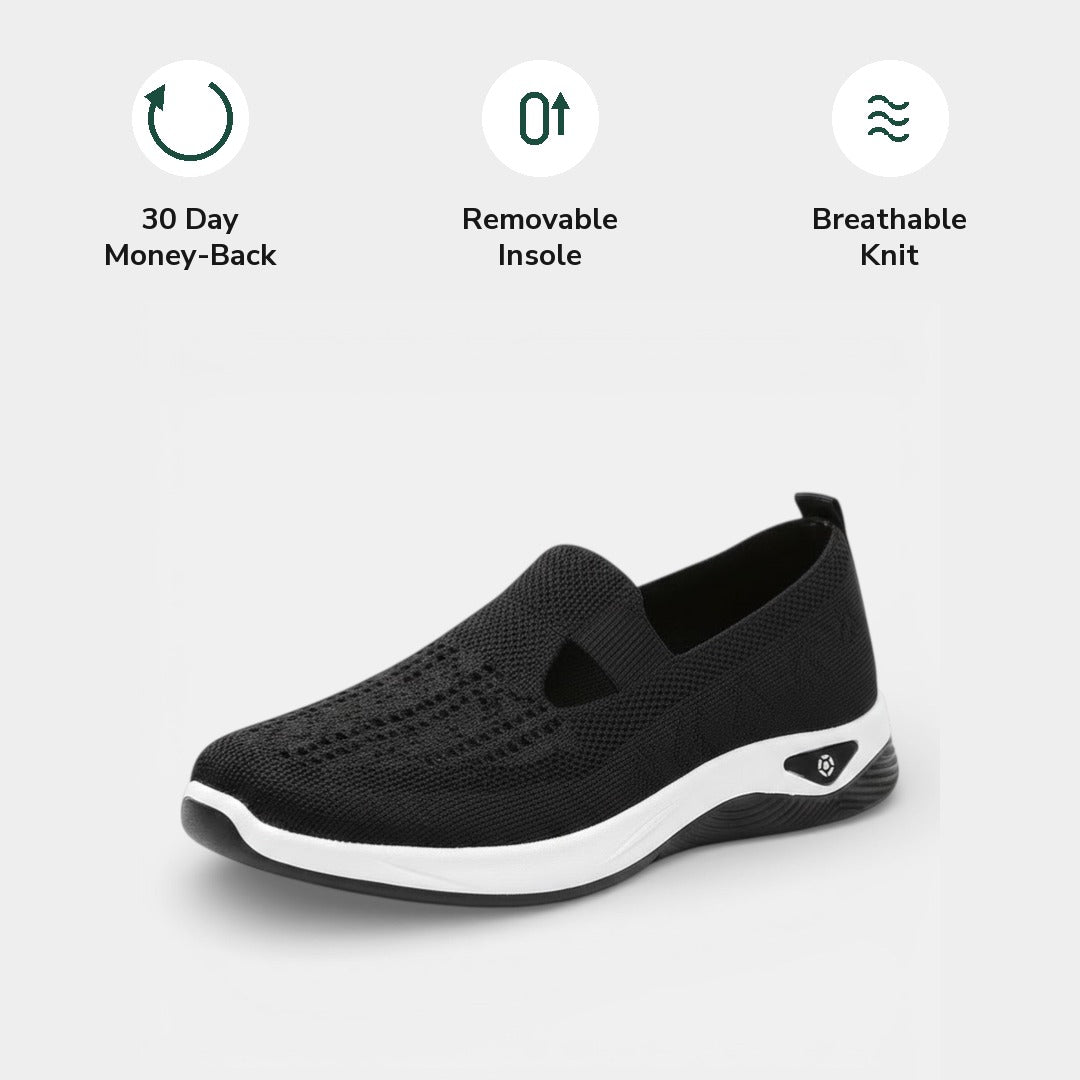 Front view of a white Margot slip-on sneaker, displaying the rounded toe box designed for toe comfort.