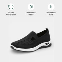 Front view of a white Margot slip-on sneaker, displaying the rounded toe box designed for toe comfort.