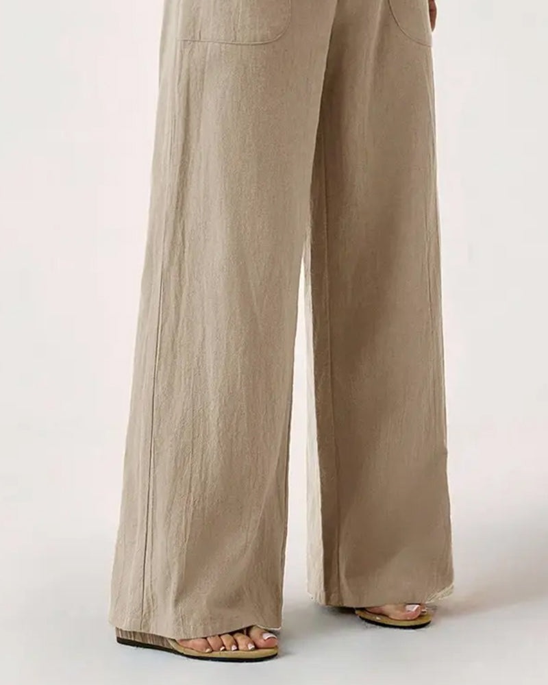 Side profile of the Marlène trousers in khaki, highlighting the comfortable, relaxed silhouette.