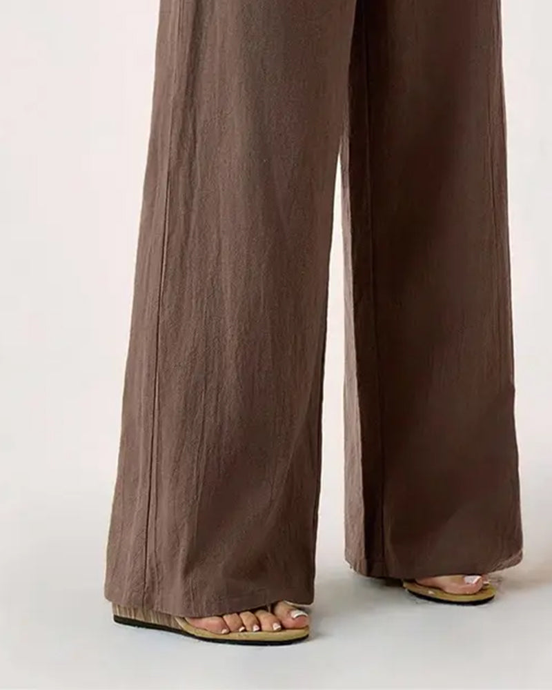 Arrangement of the coffee casual trousers folded neatly, displaying the fabric quality.