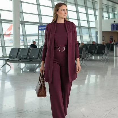 Close-up detail of the fabric texture and elasticated waistband on the trousers of the burgundy Marlowe elegant 3-piece set.