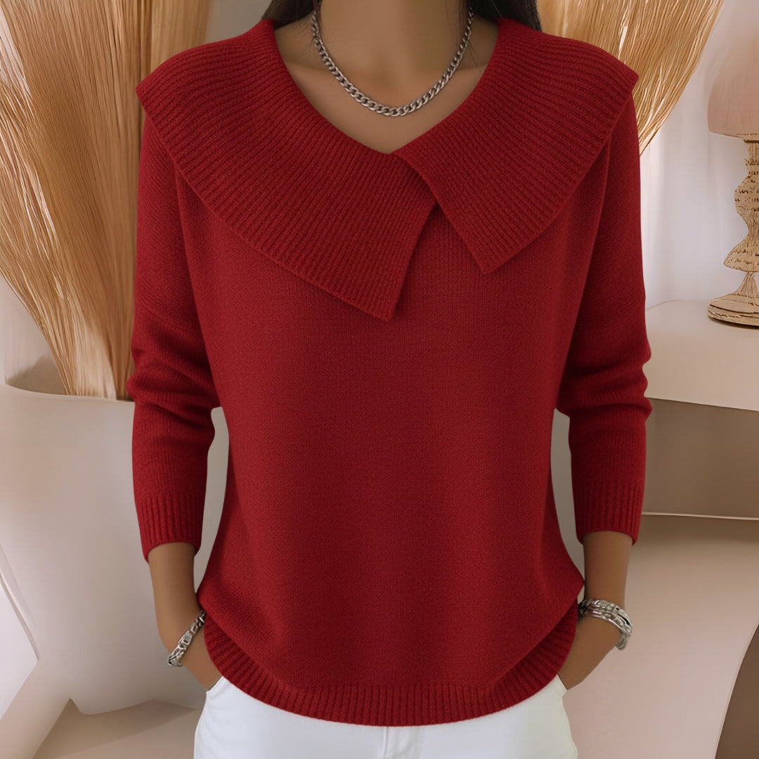 Side profile of a pink knitted soft collar sweater, highlighting the soft fabric texture and casual drape.