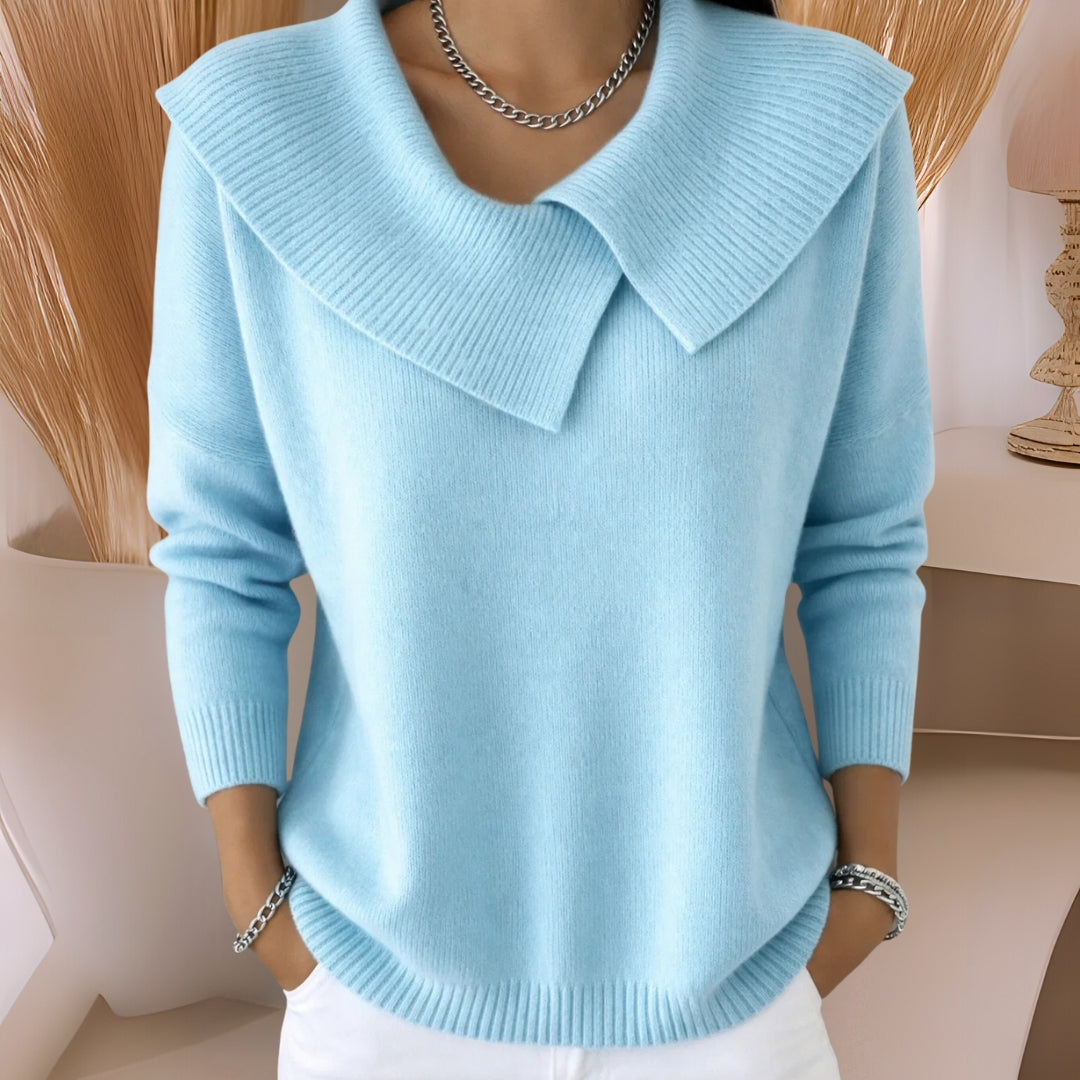 Model wearing a light blue knitted soft collar sweater, styled casually for a comfortable, chic look.
