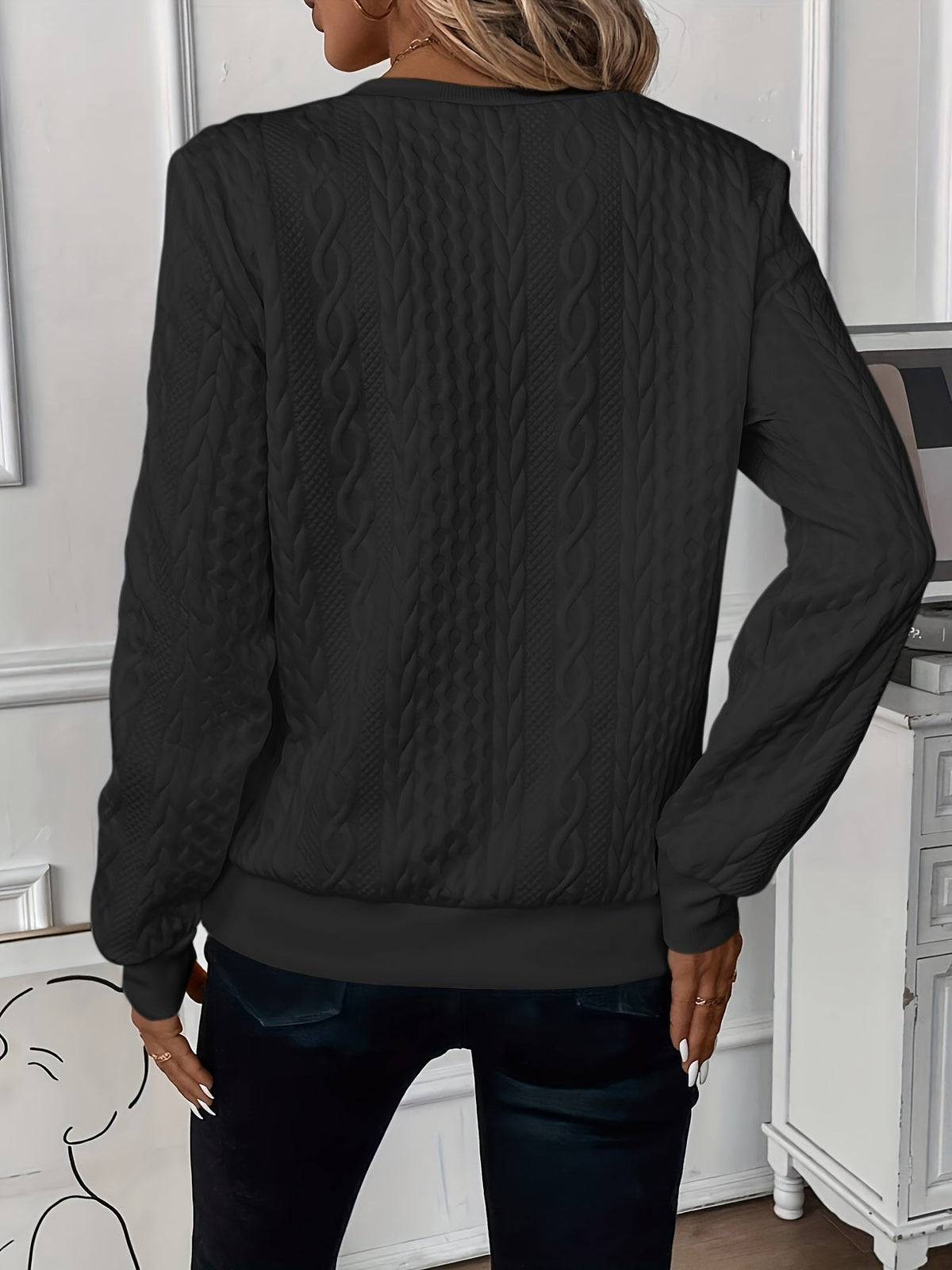 Close-up of the unique white with black zipper variation of the Alessia knitted jumper.