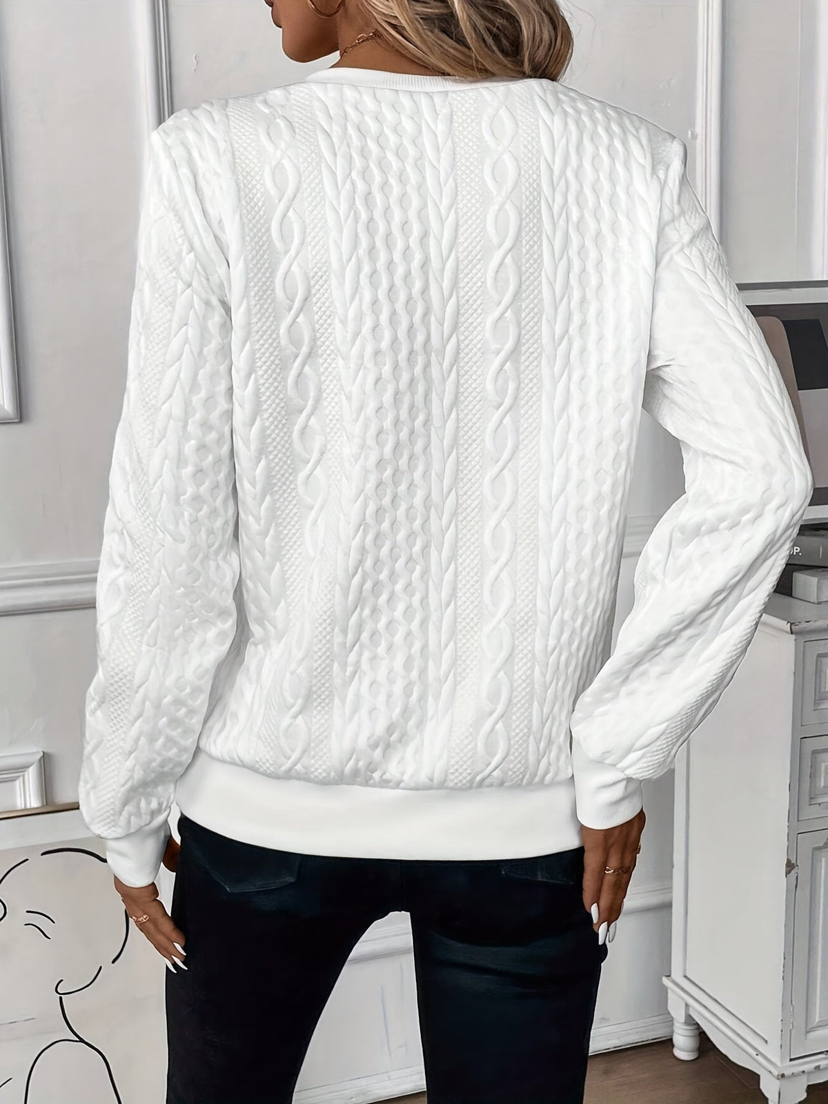 Close-up detail of the soft knitted texture on the Alessia jumper sleeve.