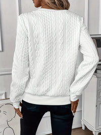 Close-up detail of the soft knitted texture on the Alessia jumper sleeve.