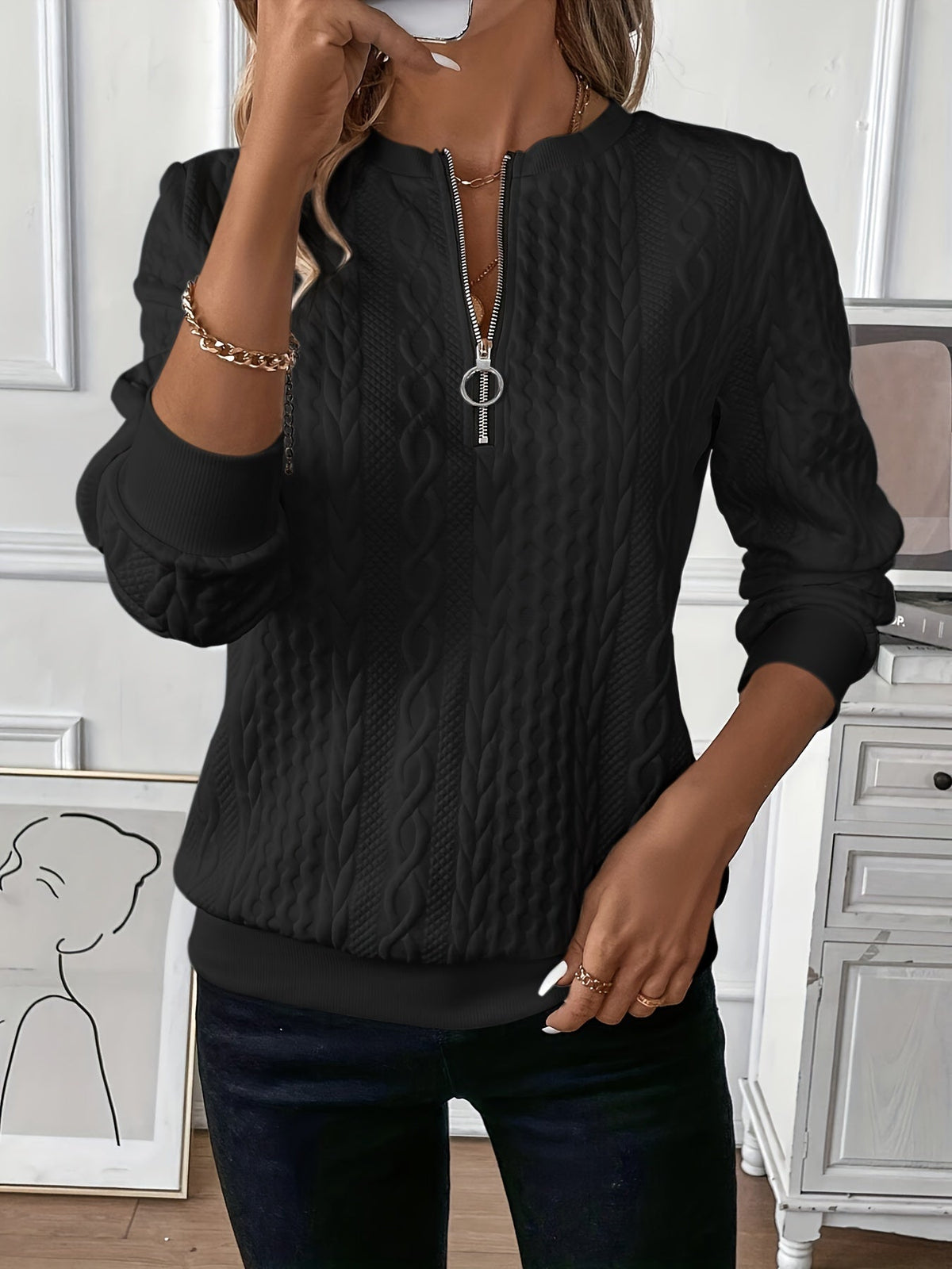 A woman in a professional setting, wearing the Alessia elegant knitted jumper, looking confident.