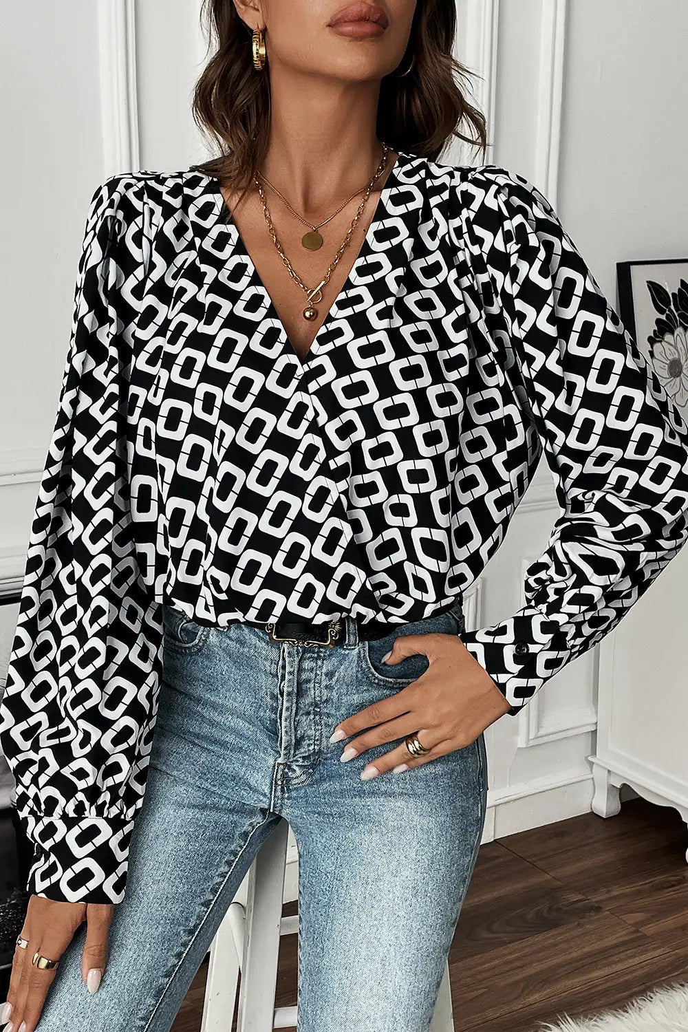 Rear view of the versatile Nadia long sleeve blouse, showing its full length and the drape of the polyester fabric.