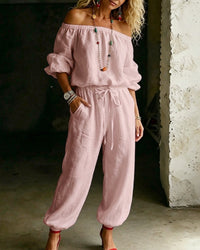 View of the long sleeves and their comfortable fit on the Rhiannon off-shoulder cotton jumpsuit.