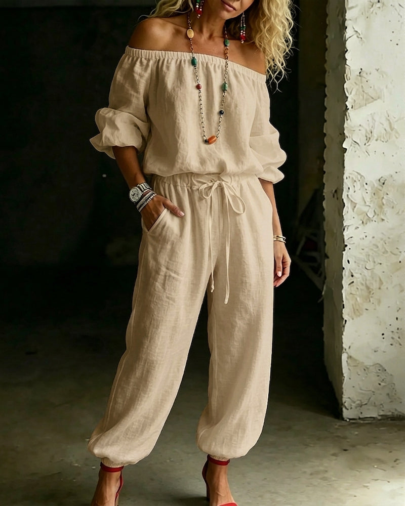 Front view of the Rhiannon cotton jumpsuit in a classic black, offering a sophisticated casual option.