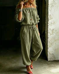 Back angled view of the Rhiannon off-shoulder cotton jumpsuit, showing the relaxed fit from behind.