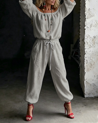 A full-length shot of the Rhiannon cotton jumpsuit in a crisp white, perfect for warm weather occasions.