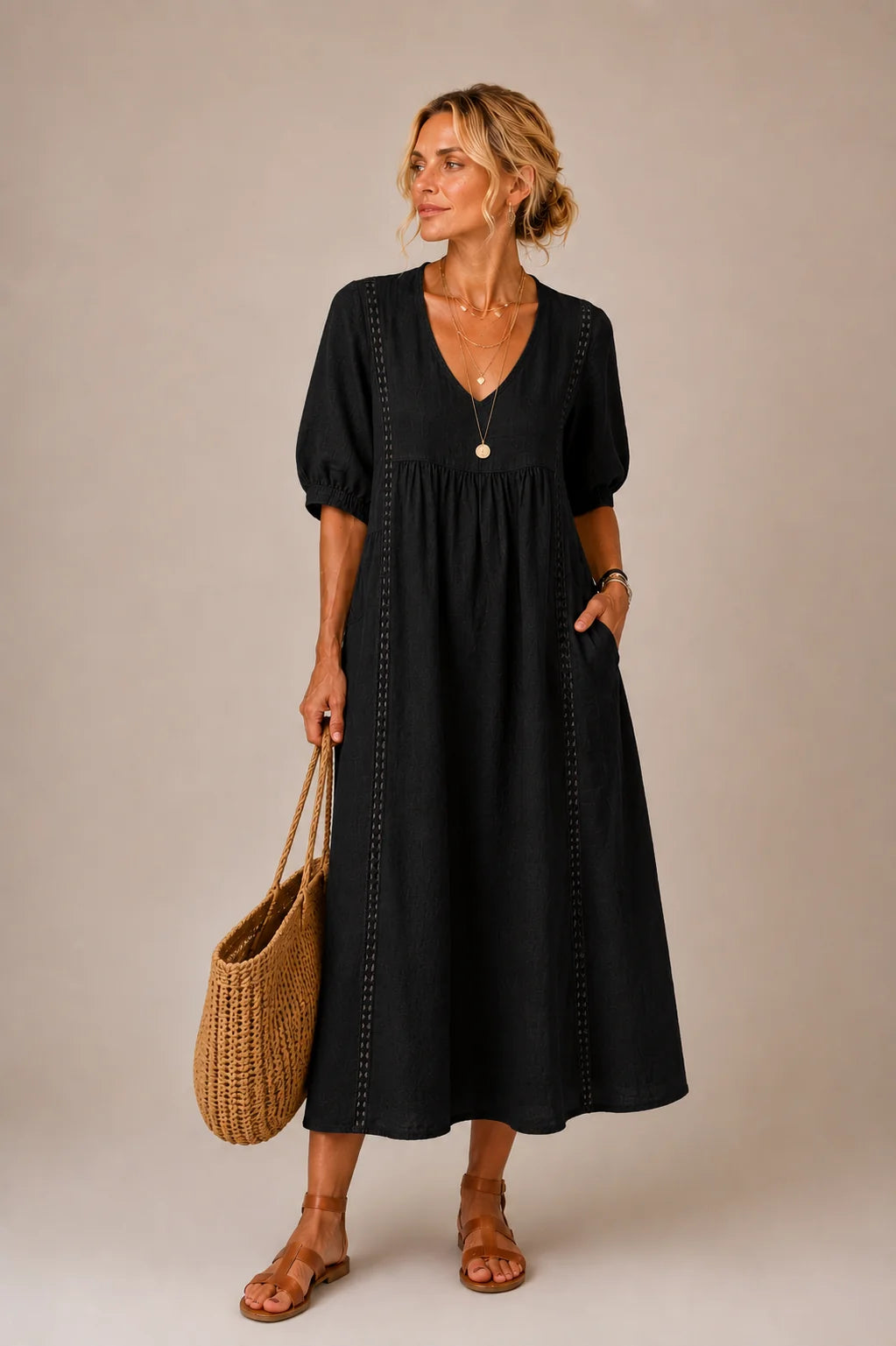 Lifestyle shot of a woman wearing the Naomi elegant lace linen dress, enjoying a casual outdoor setting.