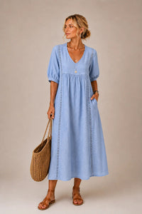 Detailed shot of the functional side pockets on the elegant lace linen dress, emphasising convenience.