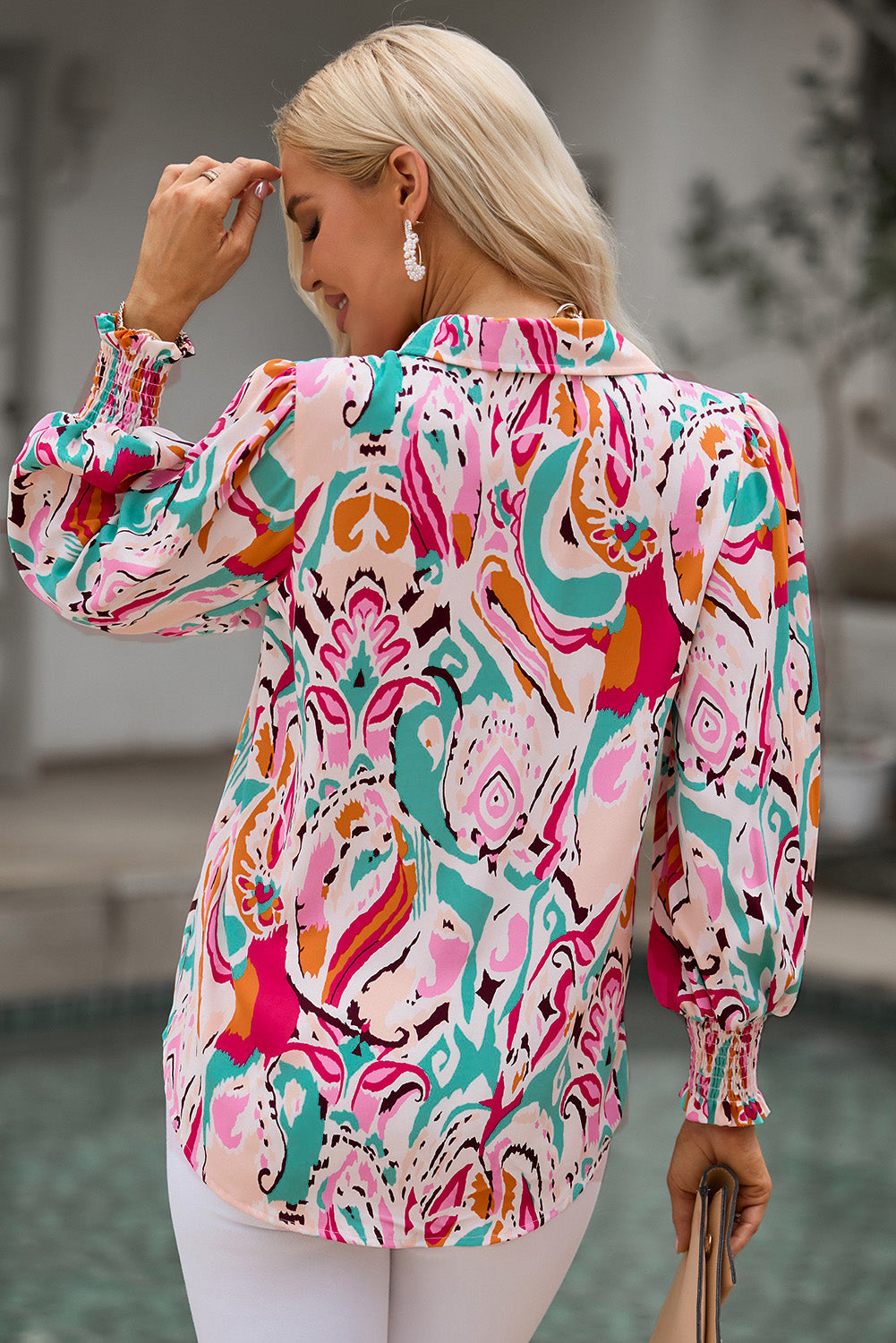Side profile of the elegant hot pink printed puff sleeve blouse, highlighting the volume of the lantern sleeves.