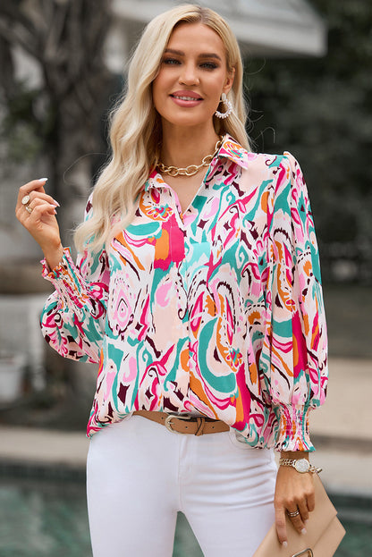 Back view of the hot pink printed puff sleeve collared blouse, demonstrating its regular fit and flow.