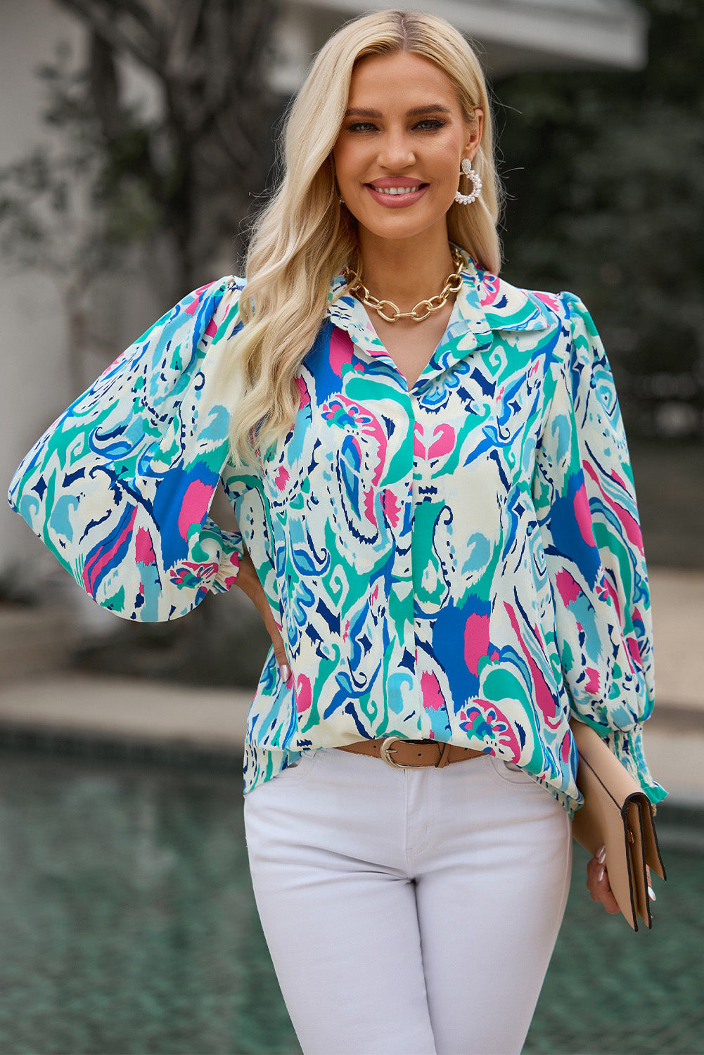 Model wearing the pastel blue printed puff sleeve collared blouse, paired with trousers for an office ensemble.