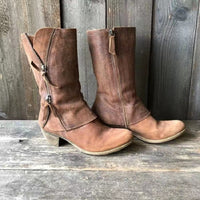 Side profile of a brown premium leather cowgirl boot, showcasing the elegant mid-heel and classic Western stitching.