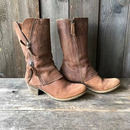 Side profile of a brown premium leather cowgirl boot, showcasing the elegant mid-heel and classic Western stitching.