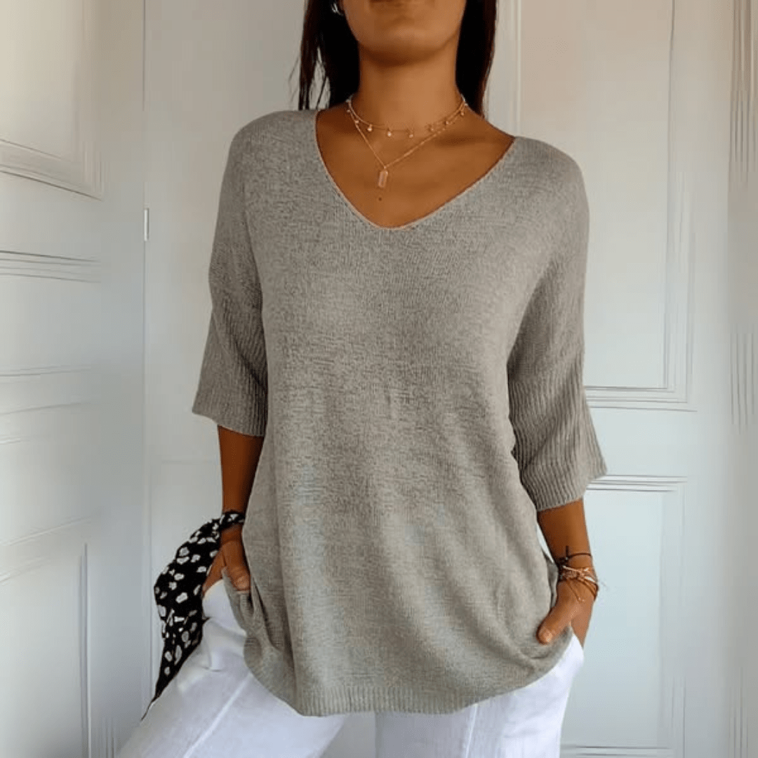 Rear view of the Ophelia loose sweater, demonstrating the smooth, clean finish of the hemline.