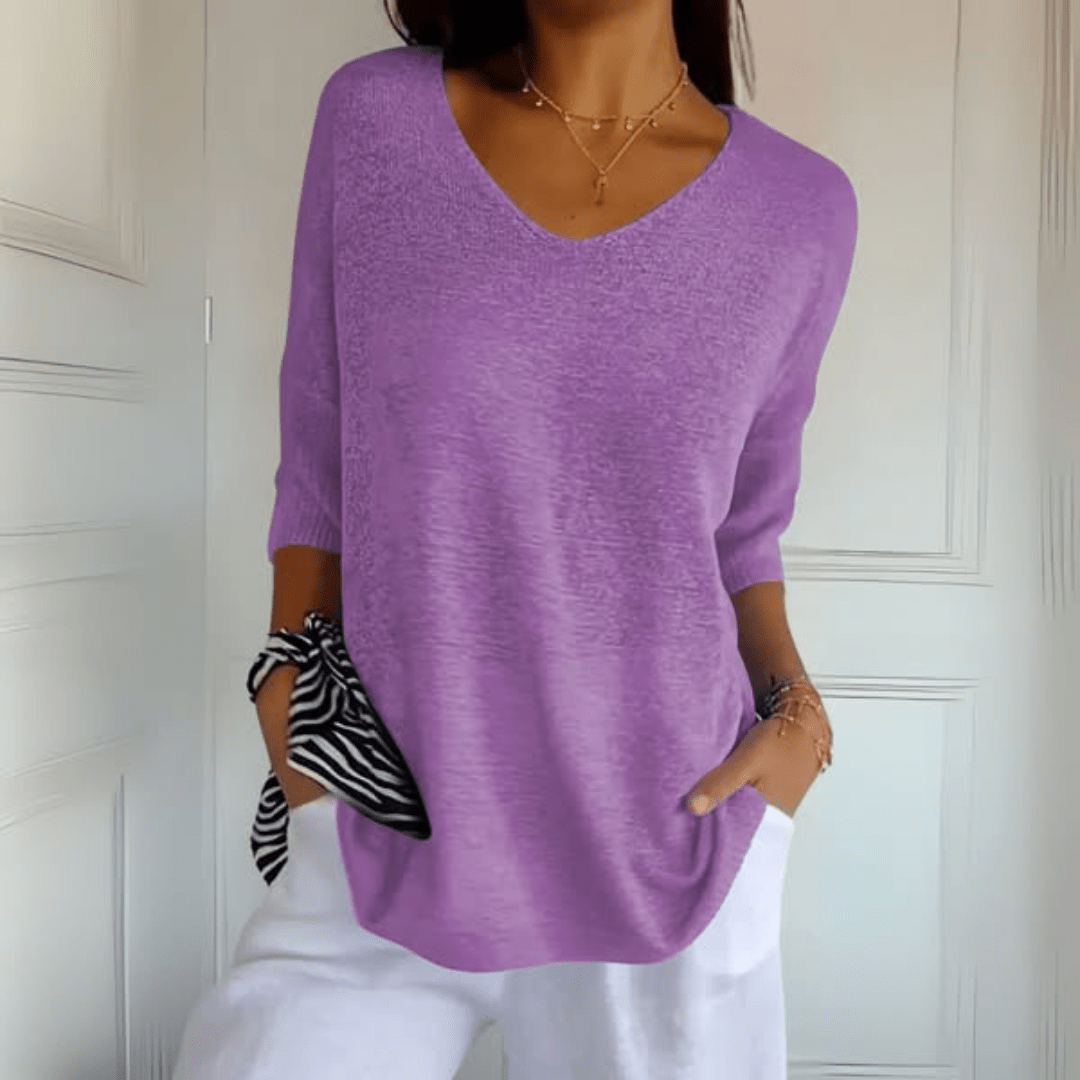 The Ophelia V-Neck loose sweater folded neatly, showing its compact and travel-friendly nature.