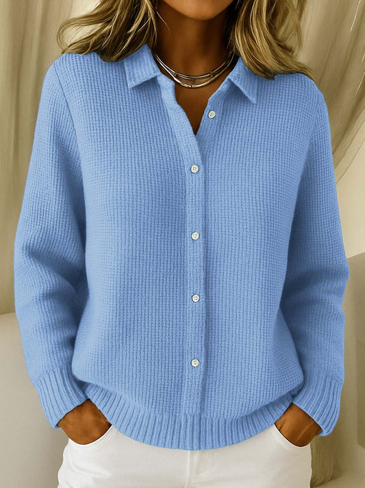 Front view of a blue Peridot women's collared jumper with all buttons fastened, showcasing the ribbed trim.