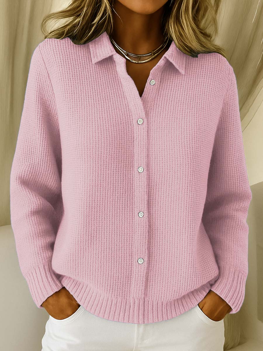 Side profile of a model wearing a pink Peridot women's collared jumper, highlighting the straight sleeve silhouette.