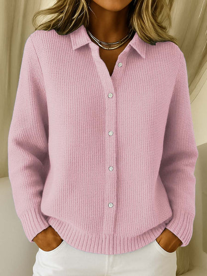Side profile of a model wearing a pink Peridot women's collared jumper, highlighting the straight sleeve silhouette.