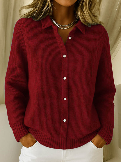 Lifestyle shot of a red Peridot women's collared jumper, styled casually with jeans, focusing on its versatile appeal.