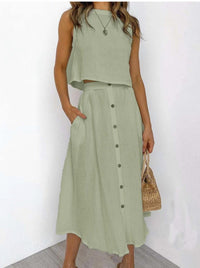 Lifestyle shot of a model wearing the blue Perla chic two-piece set, demonstrating its comfortable fit and flowy style.
