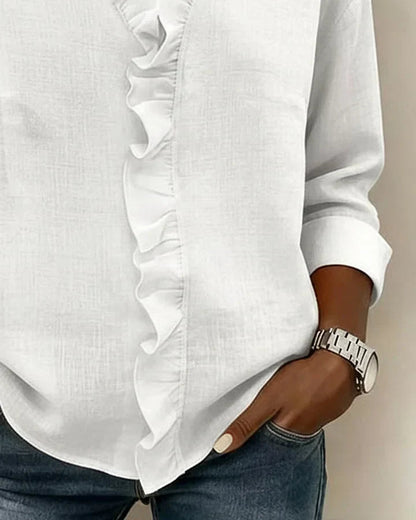 Detail of the fabric texture of the Persephone blouse, emphasising its lightweight and flowing nature.