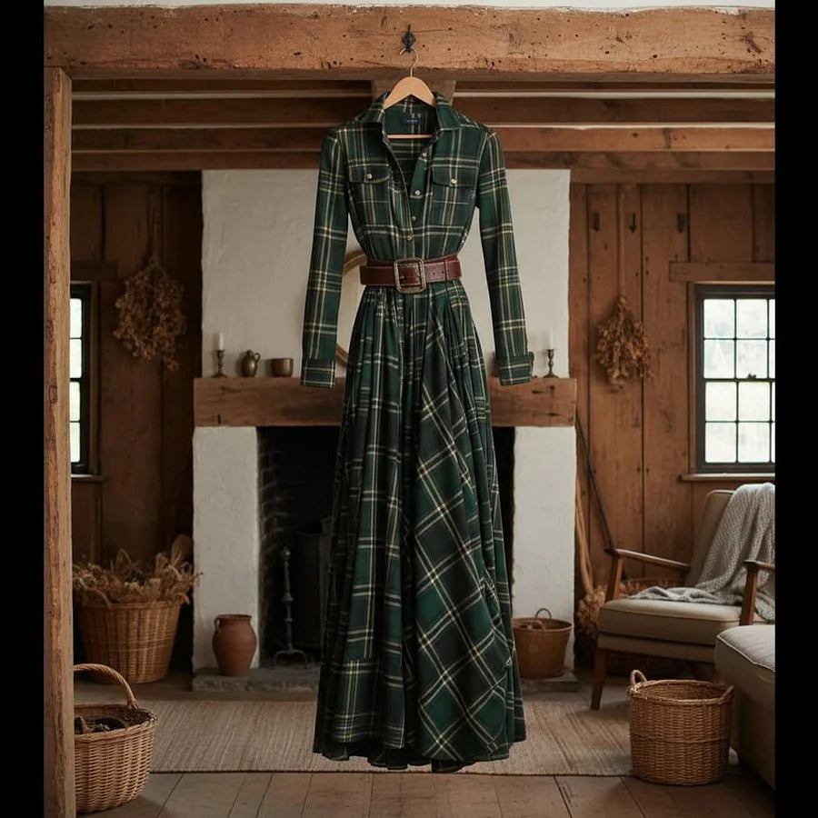 Lifestyle shot of a woman wearing the Rhiannon green plaid maxi dress in an autumnal outdoor setting.