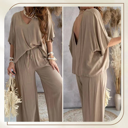 Front view of a woman wearing the blue comfortable loungewear set, standing casually with hands in pockets.