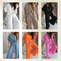 Back view of a woman walking away, highlighting the flow and drape of the black comfortable loungewear set.