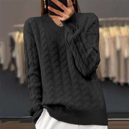 Back view of the elegant Rosalie Classic Cable Knit Sweater, demonstrating its versatile design.