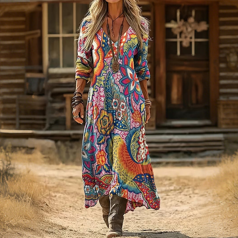 Detailed close-up of the elegant floral pattern and fabric texture on the Rosalind vintage maxi dress sleeve.