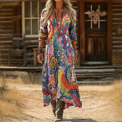 Detailed close-up of the elegant floral pattern and fabric texture on the Rosalind vintage maxi dress sleeve.