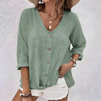 Front view of the Saskia versatile button-up blouse in a soft blue shade, showcasing the V-neckline.