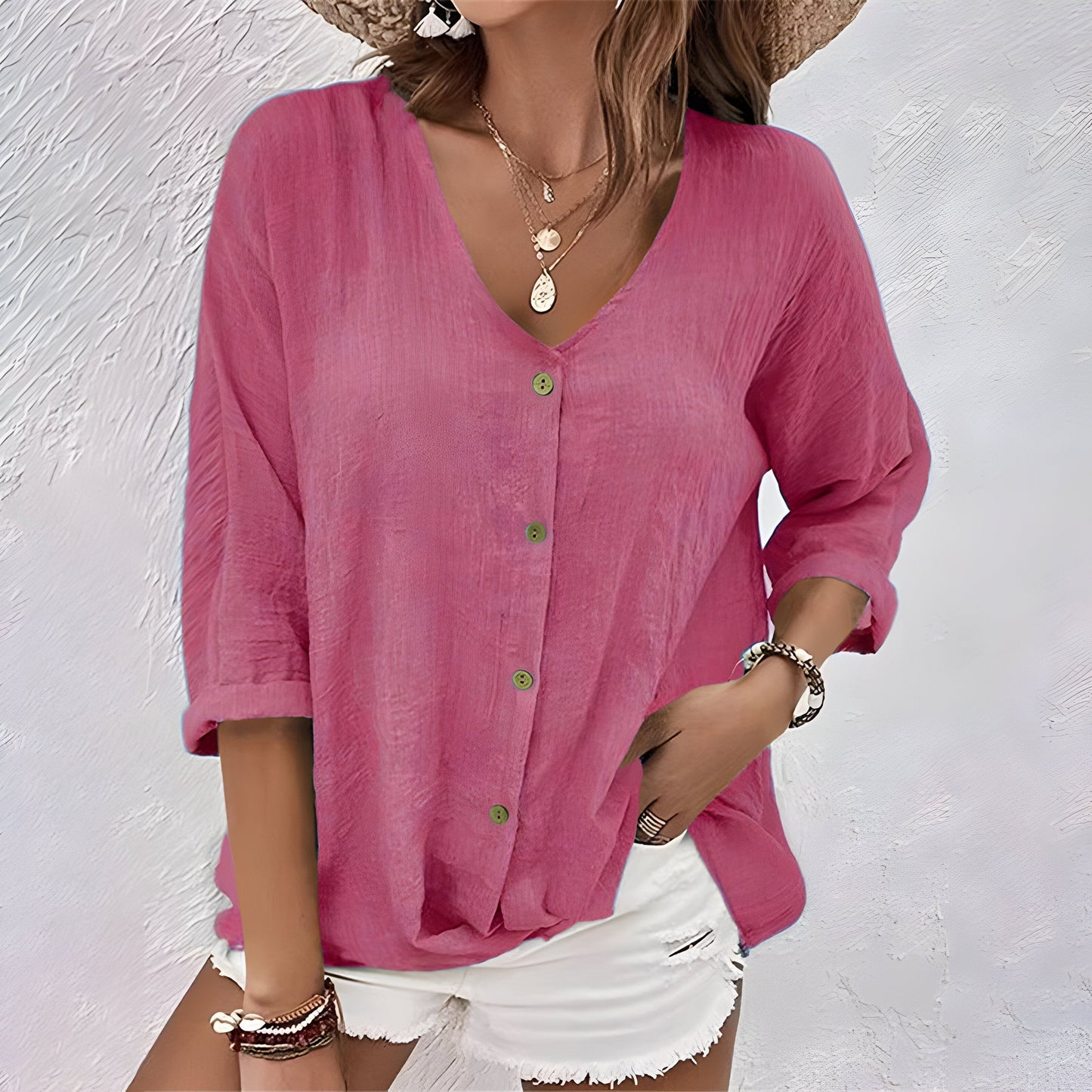 Back view of the Saskia blouse, demonstrating the relaxed, straight silhouette and hem falling below the hips.