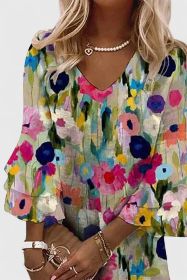 Side profile of a model wearing the floral mini dress, demonstrating its comfortable fit and playful mini length.