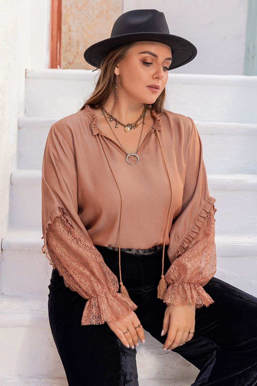 Front view of the dusty pink Solana plus size tie neck blouse, showcasing its elegant ruffled details.