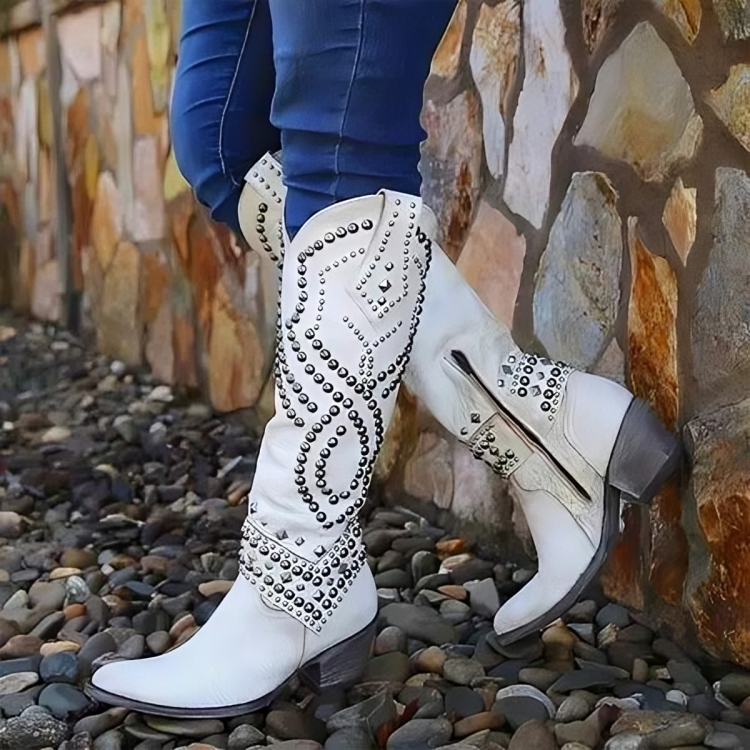 Overhead view of purple Rhiannon knee-high western boots, highlighting the sleek silhouette and material texture.