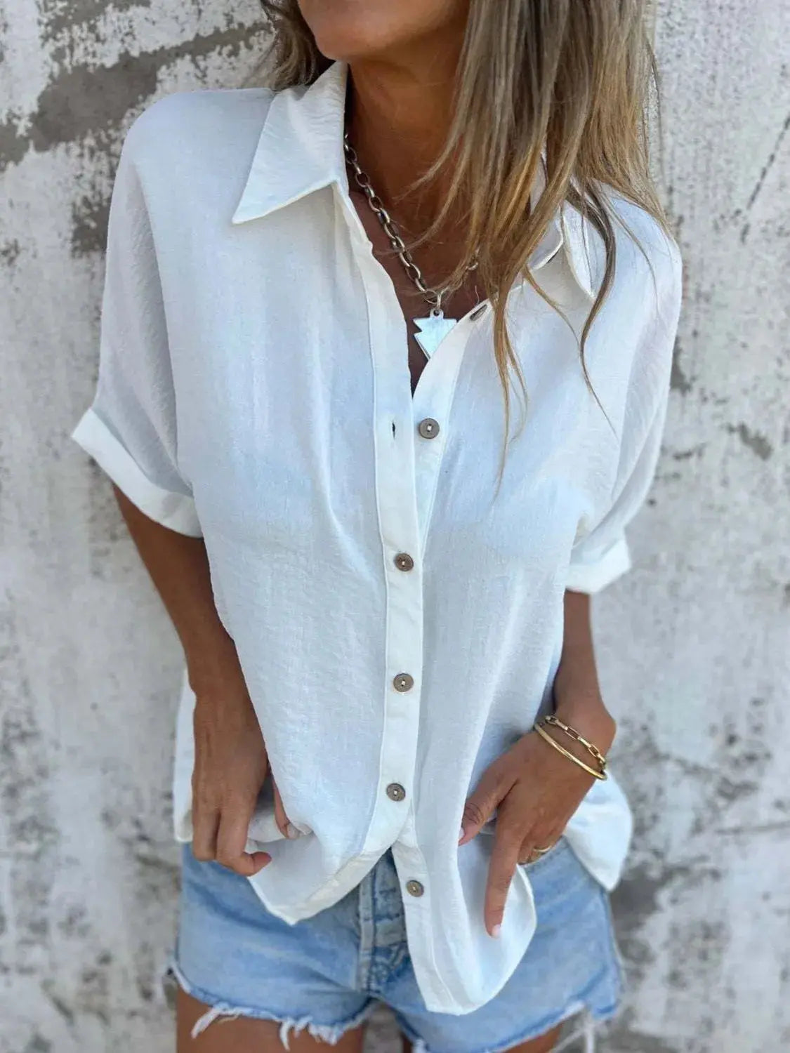 Front view of a white Seraphina classic collared shirt, showcasing the button-down front and collar detail.