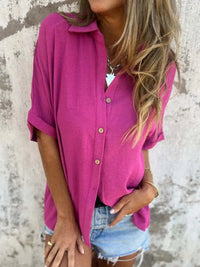 The Seraphina classic collared shirt in black, paired with a statement necklace for an elevated look.