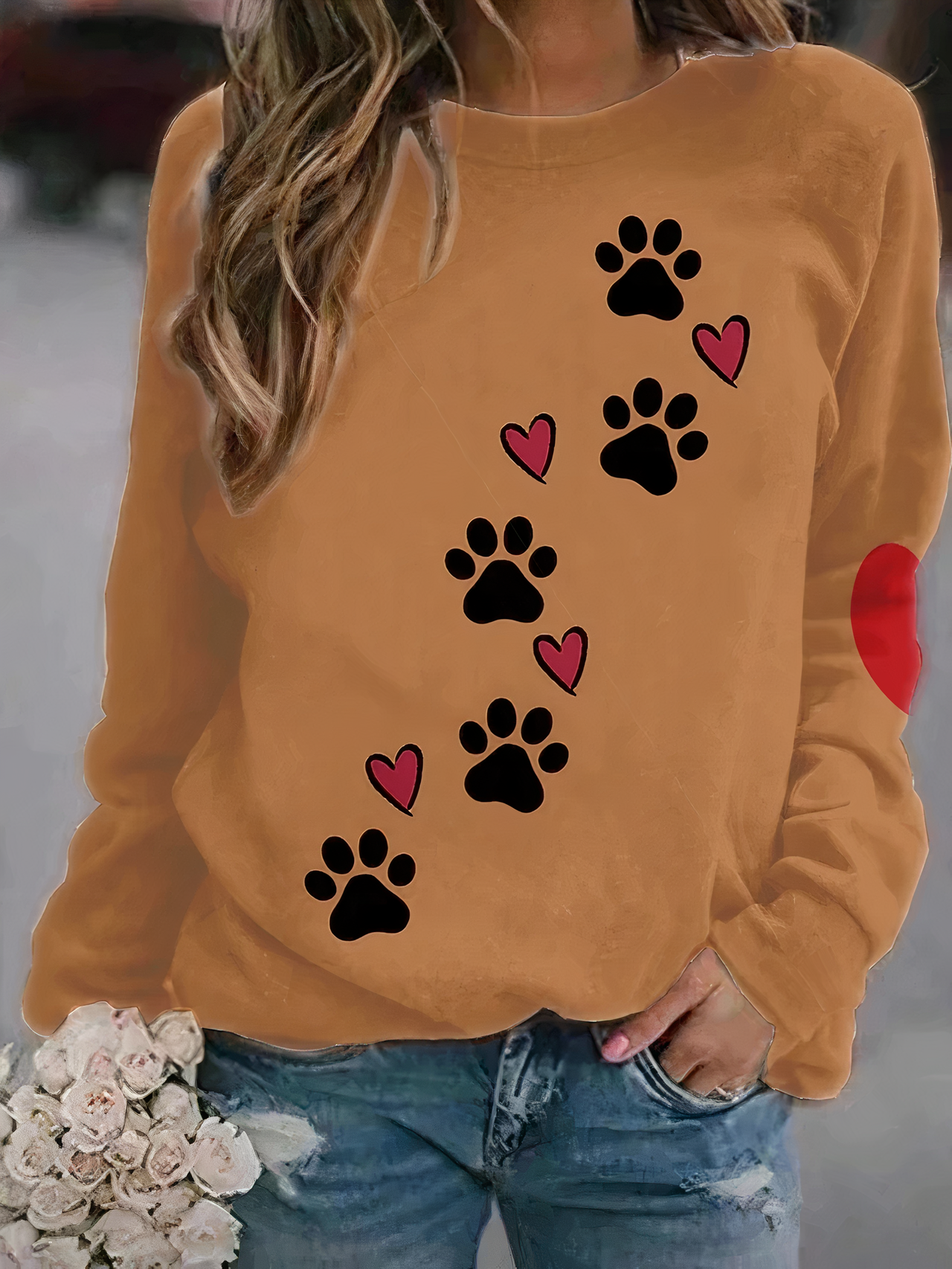 Close-up detail of the paw print motif on the fabric of the women's printed jumper, showcasing texture.