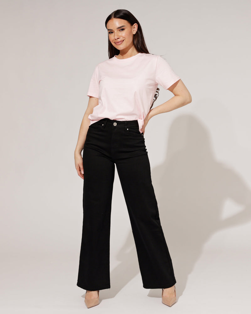 Thalassa black wide-leg jeans, front view, showcasing the high-waisted design and relaxed fit.